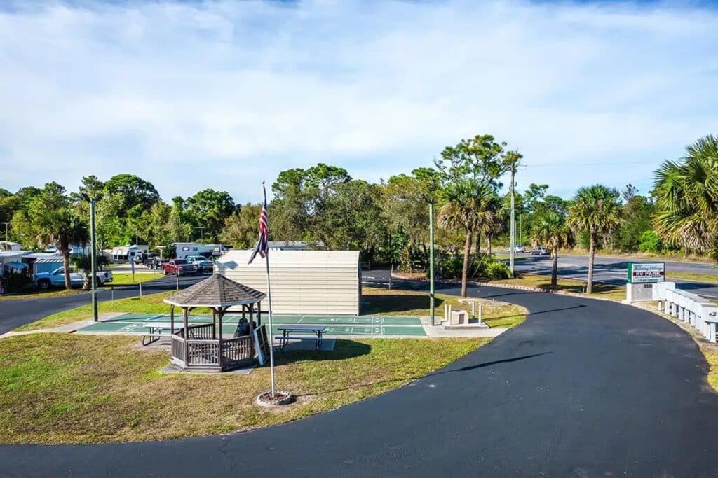 Overhead shot of Holiday Village RV Park, highlighting its beautiful landscape and amenities for visitors.