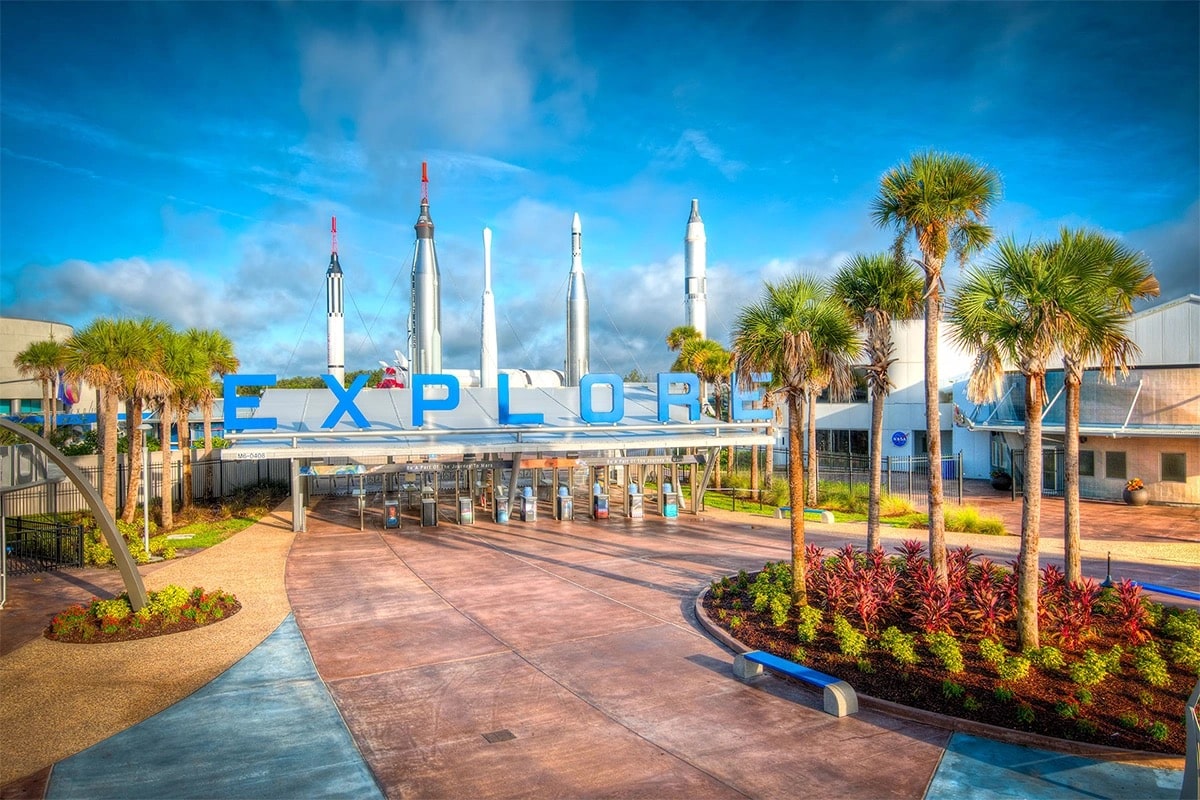 Entrance to Kennedy Space Center at Disney World, featuring iconic signage and a welcoming atmosphere for visitors. 