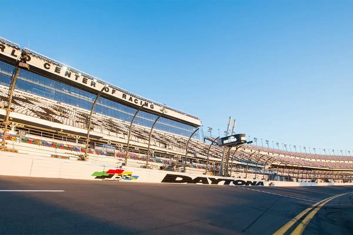 Daytona Speedway's vibrant racetrack, a key attraction near Disney World, bustling with excitement and motorsport energy.